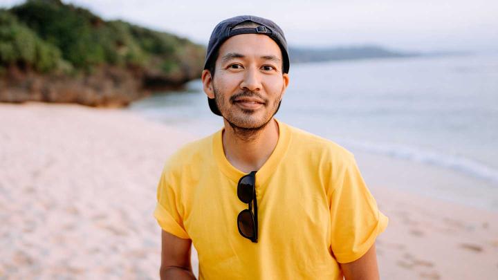 A man stands on a beach
