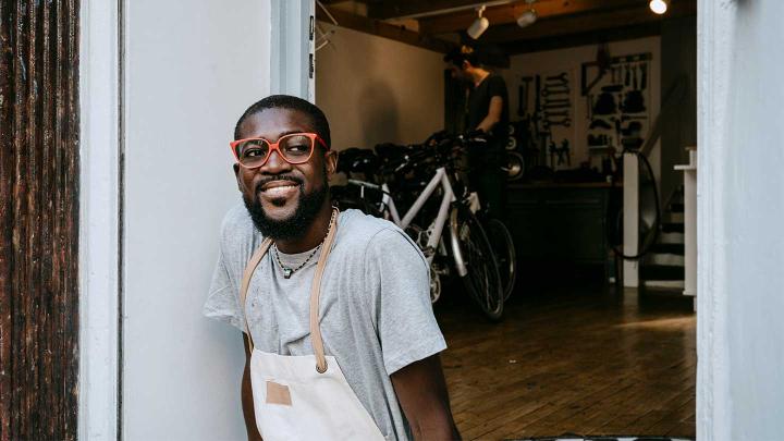 A small business owner smiles