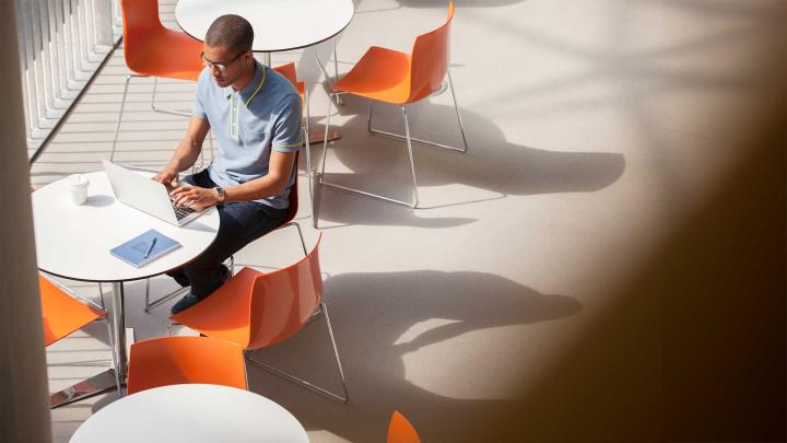 A man works on a laptop