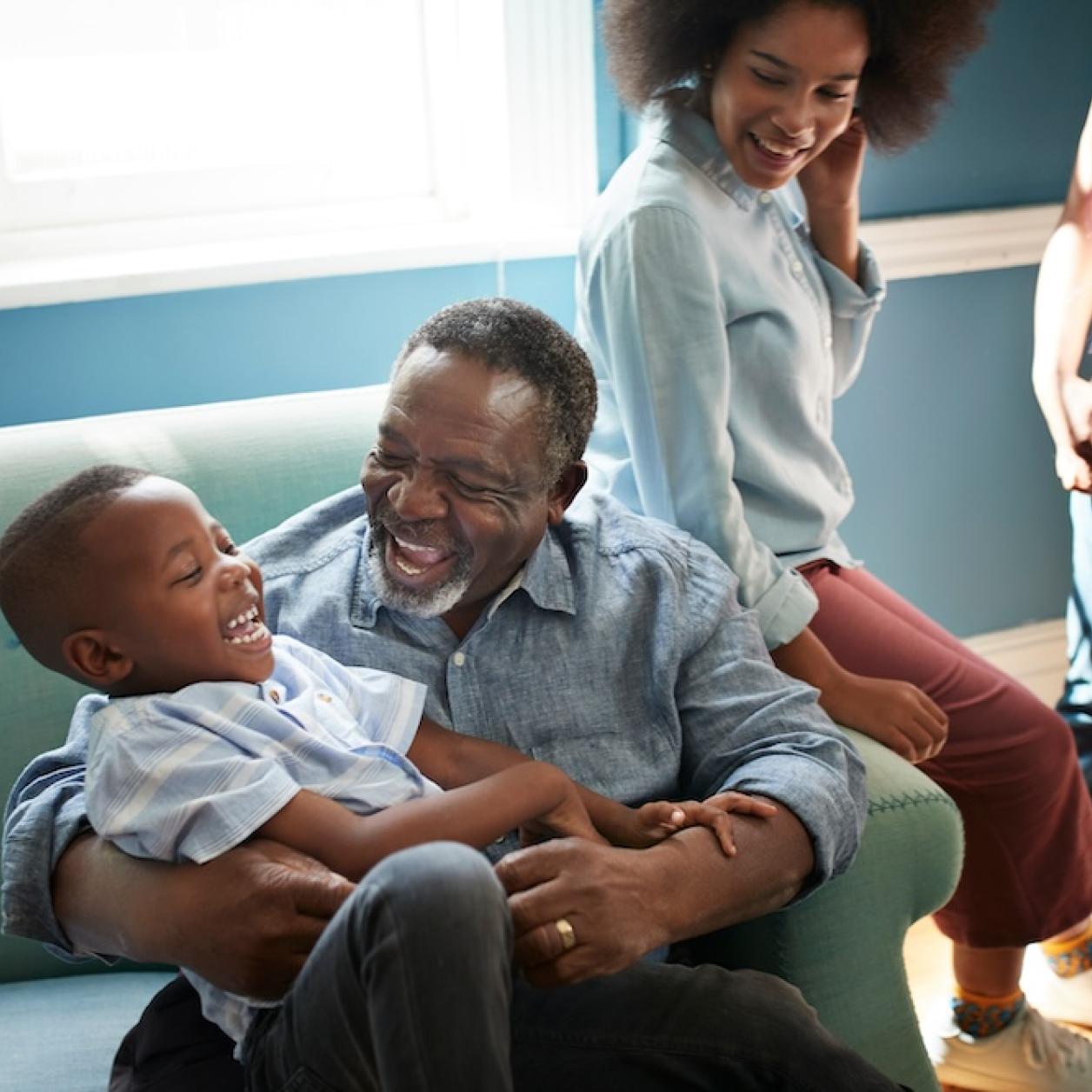 a family laughs and plays together