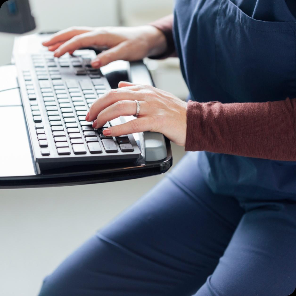 A person types on a keyboard