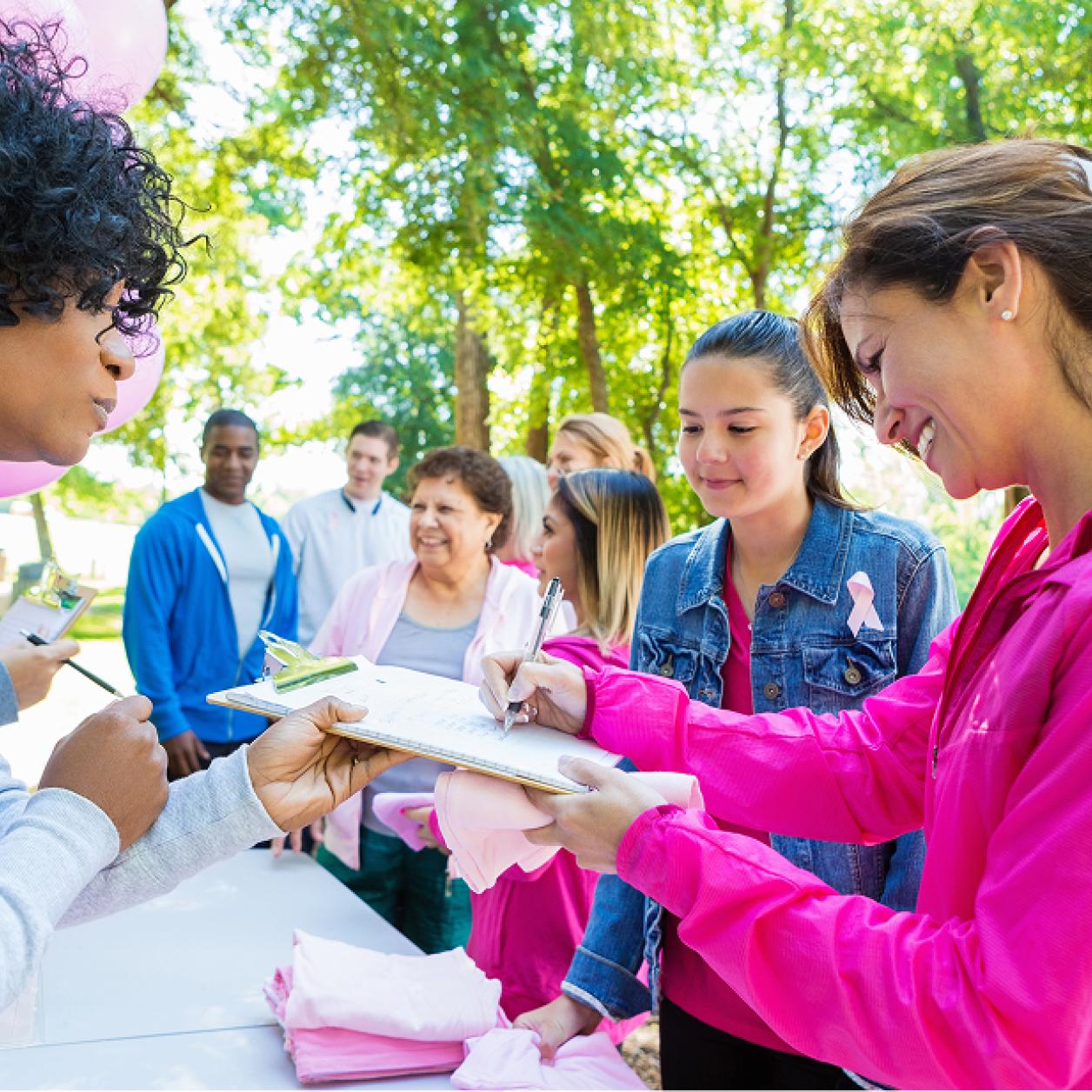 volunteering at a walk to support breast cancer patients and survivors