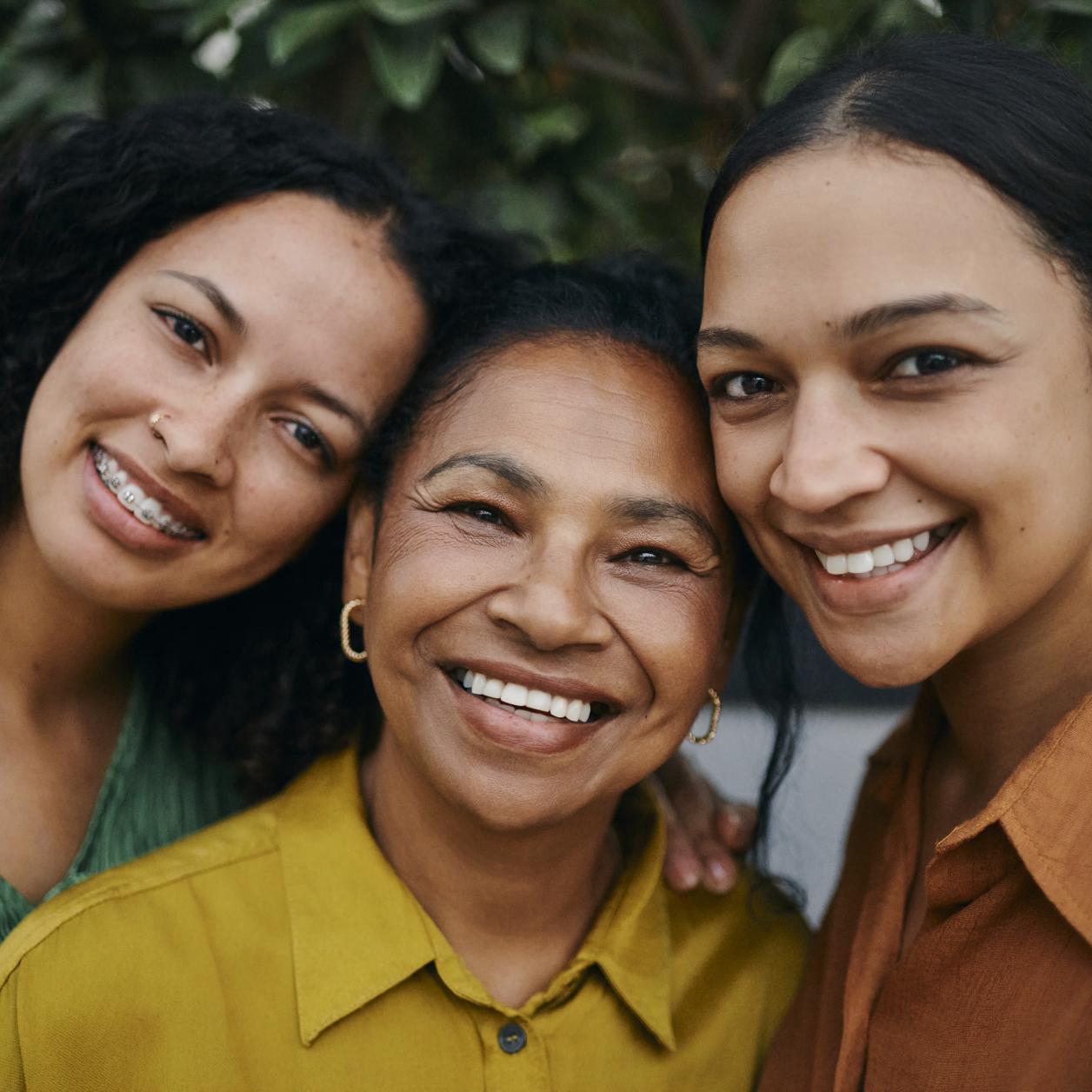 three women smiling together