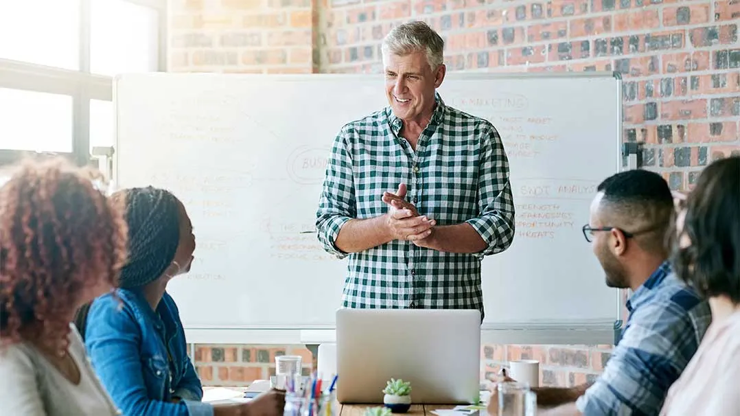 A man hosts a meeting