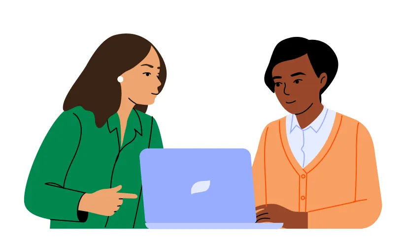 two people view a laptop together
