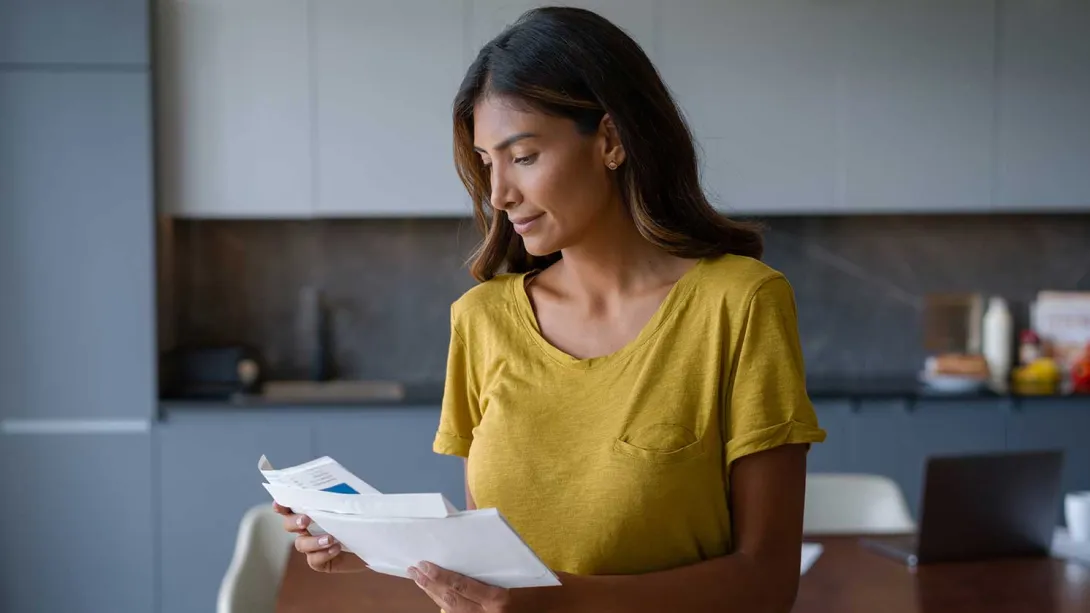 Woman looks at mail