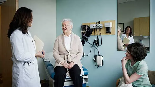 a patient and advocate meat with a doctor