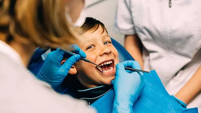 a child receives a dental exam