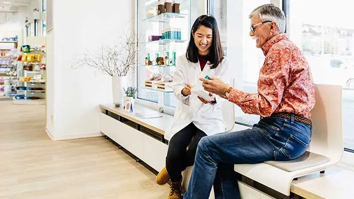 A pharmacist consults with a patient