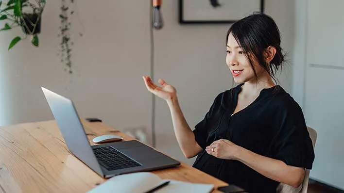 A woman uses a laptop computer