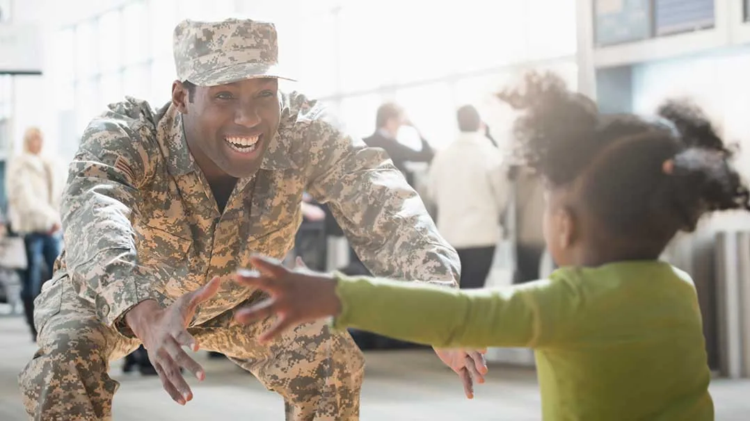 A man in the military returns home to his child
